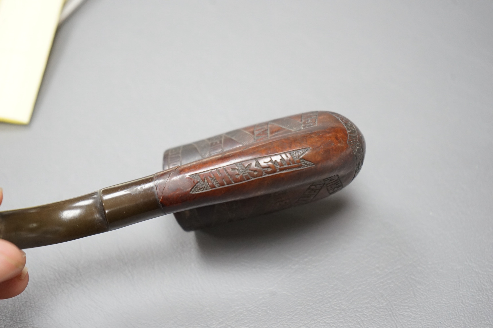 A briar and horn Boer War related smoker’s pipe, engraved with the crest for the 35th Royal Sussex regiment, together with a list of major battles and dated 1882 and 1900-02, with the initials GS to the base of the bowl.